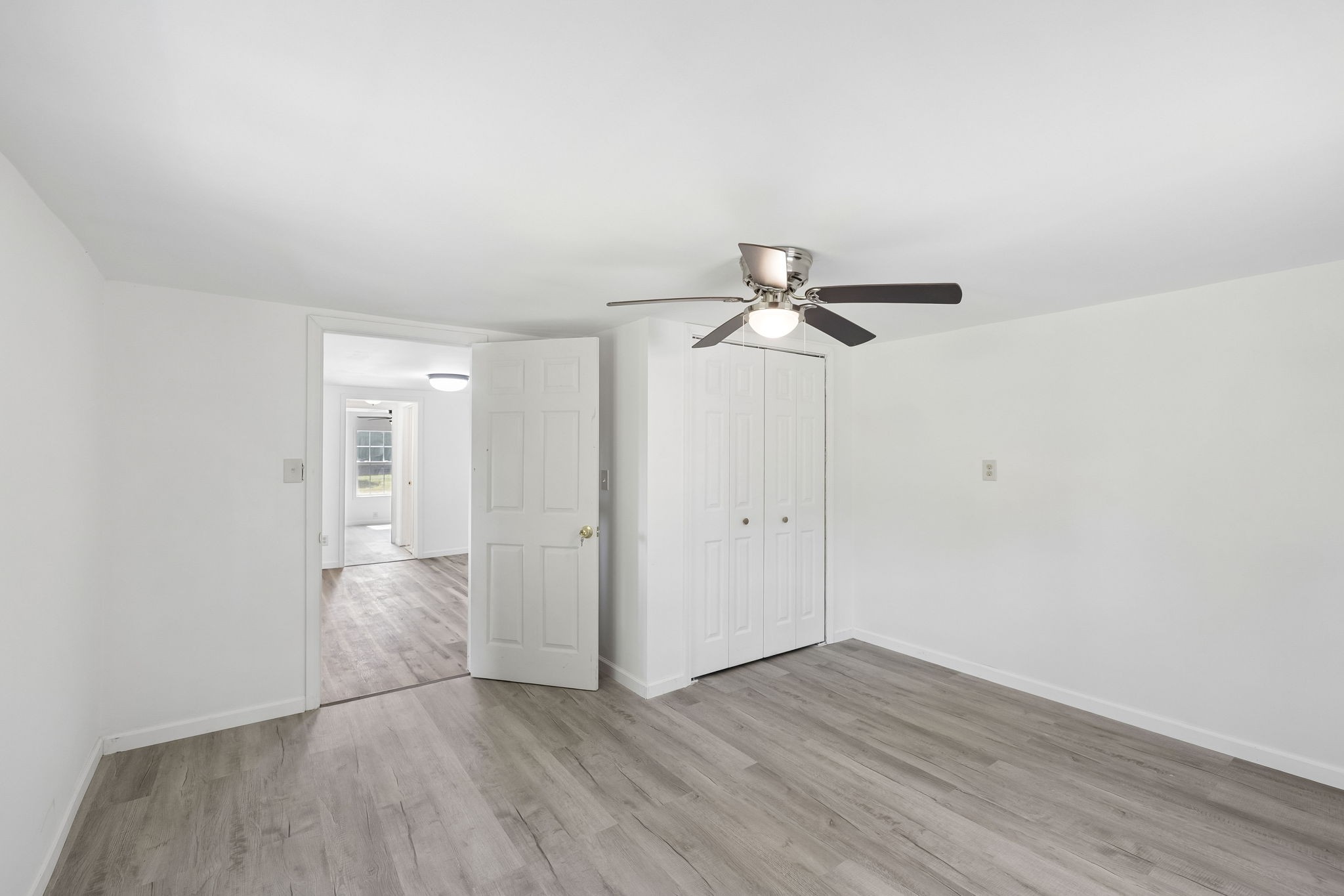 1200 Little Street Winchester, TN 37398 - Photo 12 of 54 an empty room with wooden floor closet and windows