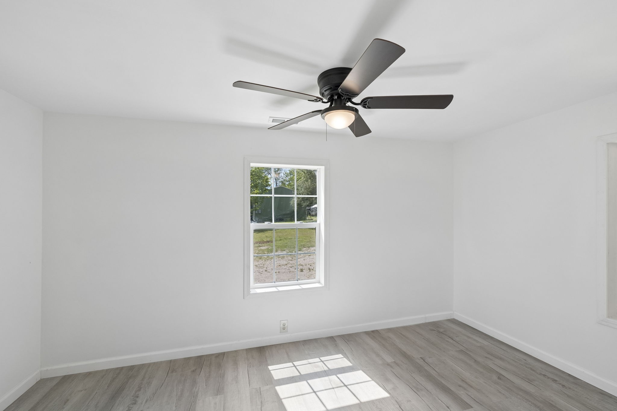 1200 Little Street Winchester, TN 37398 - Photo 15 of 54 an empty room with a window and a fan
