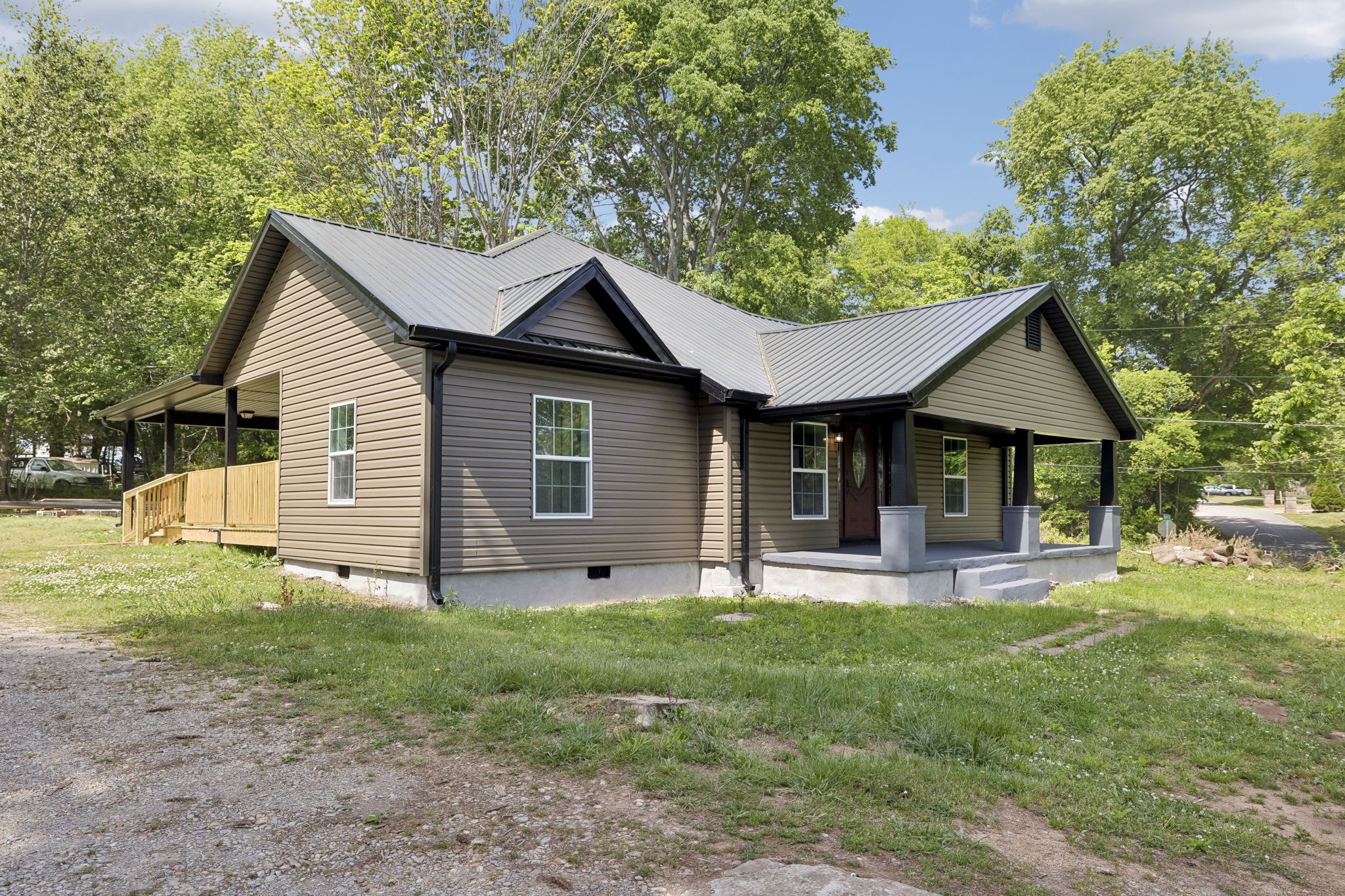 1200 Little Street Winchester, TN 37398 - Photo 2 of 54 a front view of a house with a yard and trees