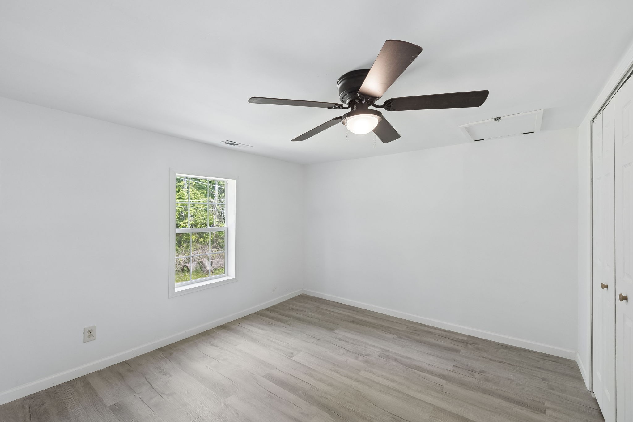 1200 Little Street Winchester, TN 37398 - Photo 25 of 54 an empty room with wooden floor fan and windows