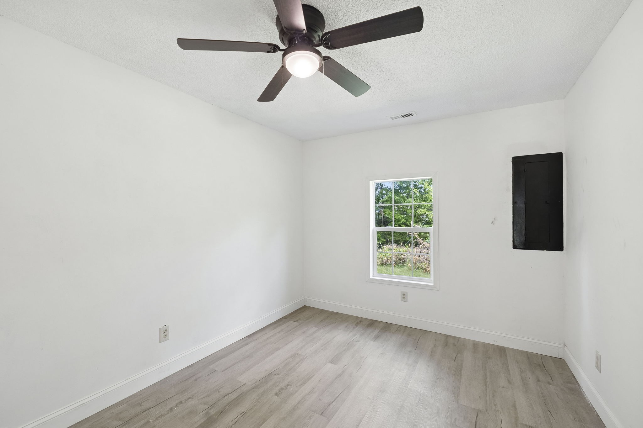 1200 Little Street Winchester, TN 37398 - Photo 31 of 54 wooden floor in an empty room with a window