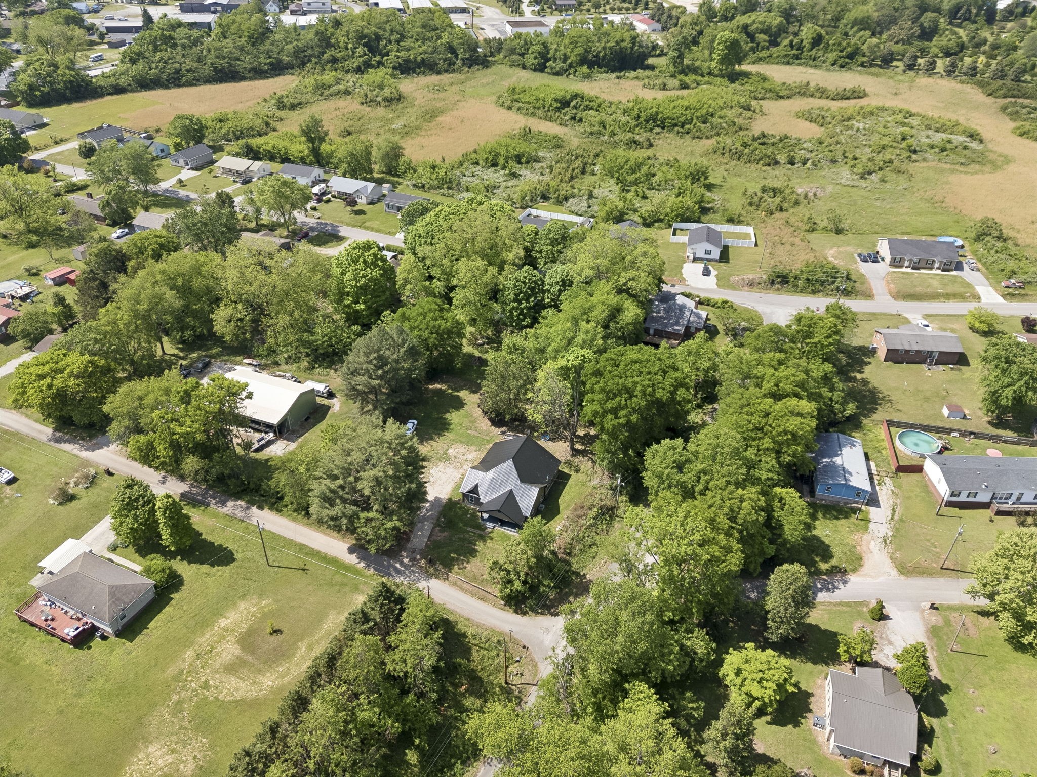 1200 Little Street Winchester, TN 37398 - Photo 53 of 54 an aerial view of residential house with parking and trees