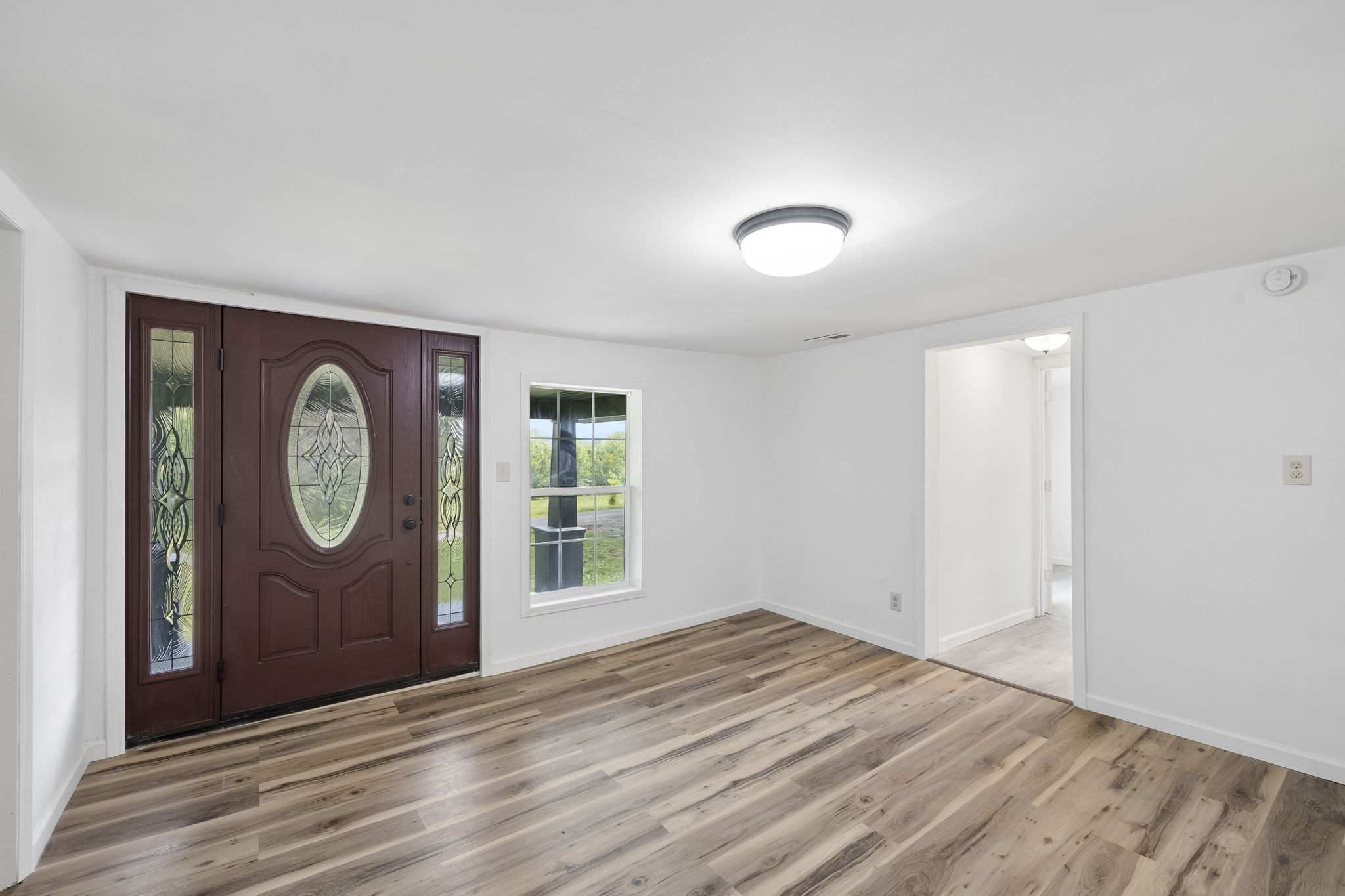 1200 Little Street Winchester, TN 37398 - Photo 8 of 54 a view of an empty room with window and wooden floor
