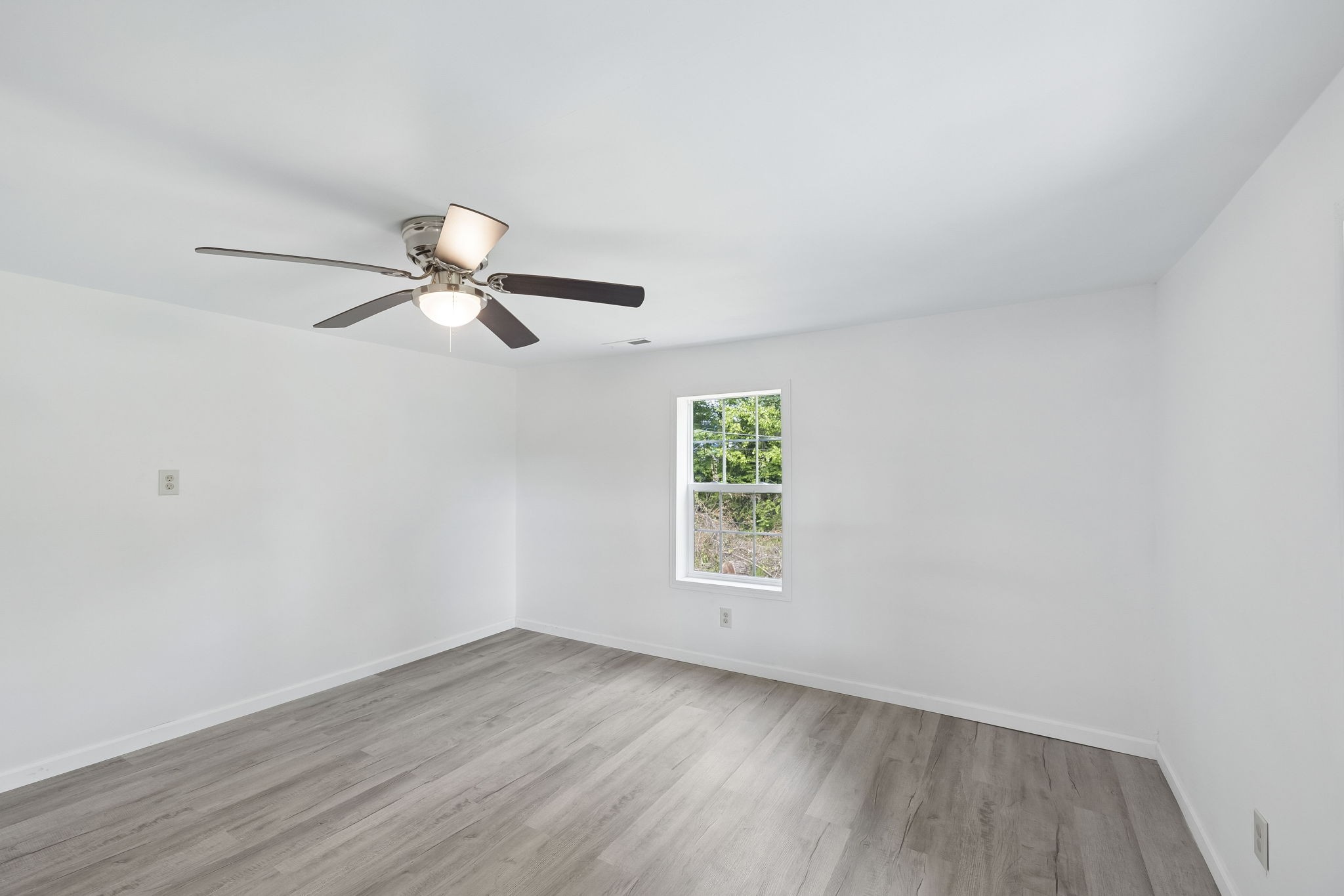 1200 Little Street Winchester, TN 37398 - Photo 10 of 54 wooden floor in an empty room with a window