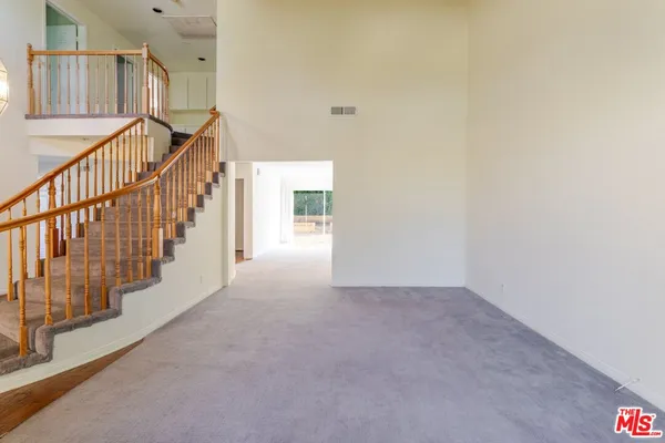 a view of an entryway with stairs
