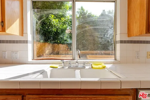 a bathroom with a bathtub and window