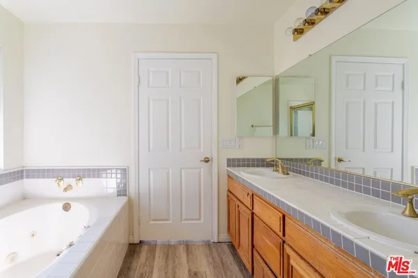a bathroom with a sink and a large mirror