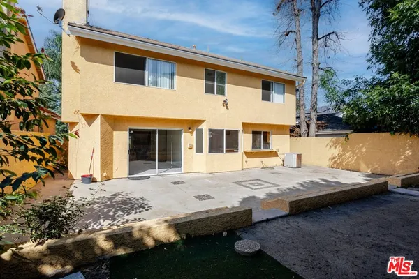 a front view of a house with yard