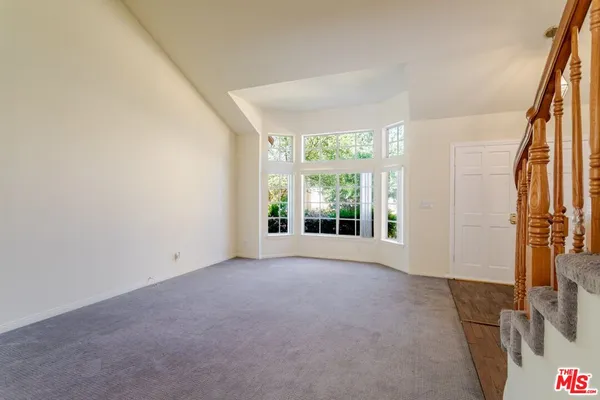 a view of a room with a large window