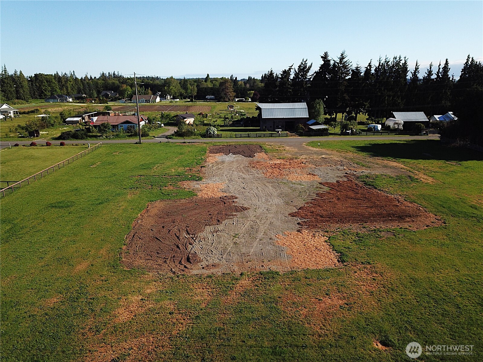 9999 Macleay Road Sequim, WA 98382 - Photo 12 of 16 a view of a street with a yard and trees