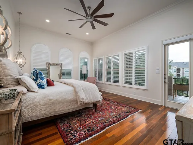 a bedroom with a large bed and a window
