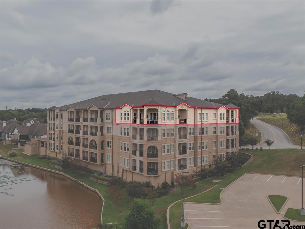 3351 Cascades Court, Unit 324 Tyler, TX 75709 - Photo 2 of 46 a front view of a house with a yard
