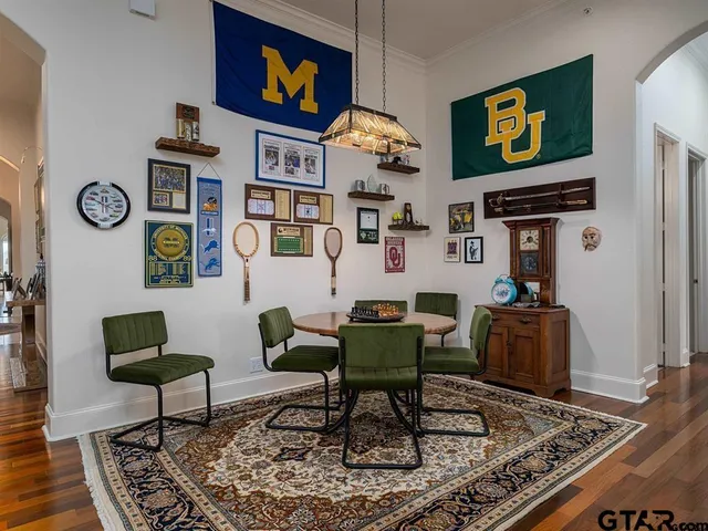 a living room with furniture and a rug