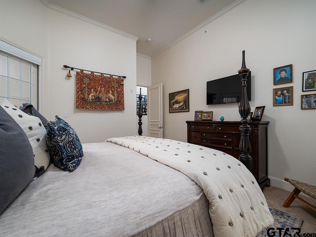 3351 Cascades Court, Unit 324 Tyler, TX 75709 - Photo 38 of 46 a bedroom with a bed and a flat screen tv