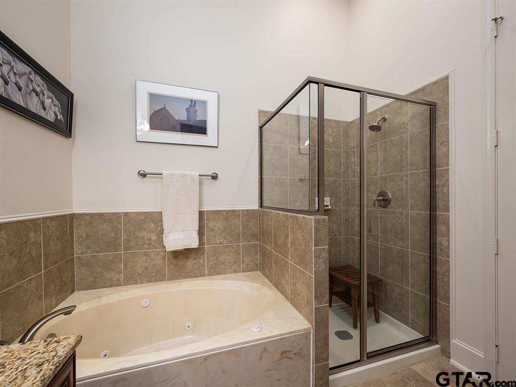 3351 Cascades Court, Unit 324 Tyler, TX 75709 - Photo 40 of 46 a bathroom with a bathtub