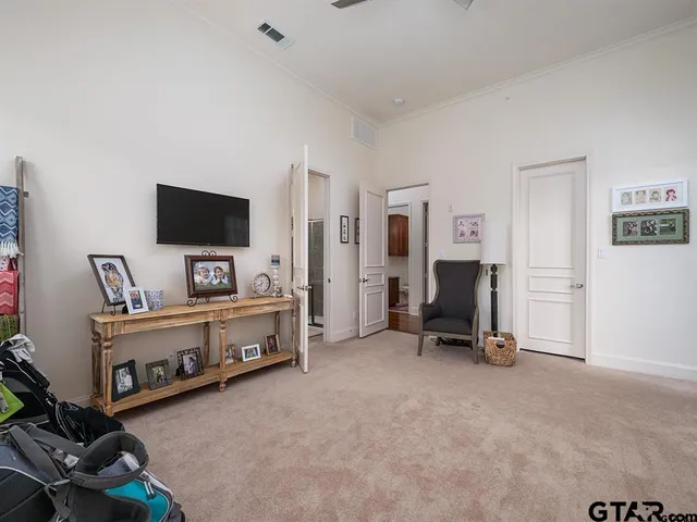 a view of a livingroom with furniture and a flat screen tv