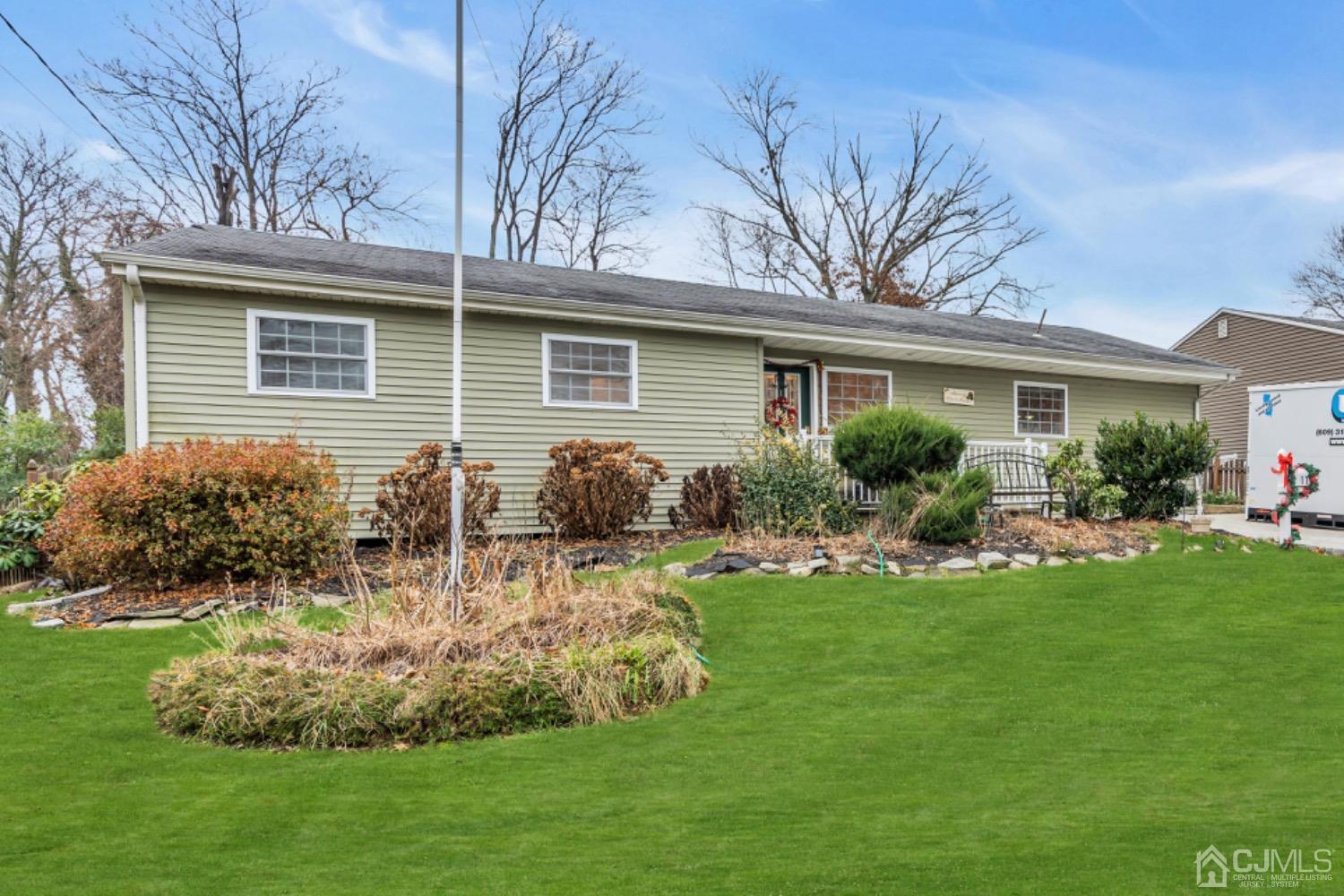17 Temple Road, Unit 17 Old Bridge, NJ 08859 - Photo 1 of 40 a front view of house with yard and green space