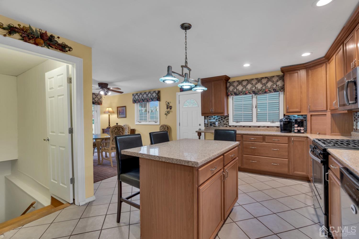17 Temple Road, Unit 17 Old Bridge, NJ 08859 - Photo 18 of 40 a kitchen with a sink a counter top space and stainless steel appliances