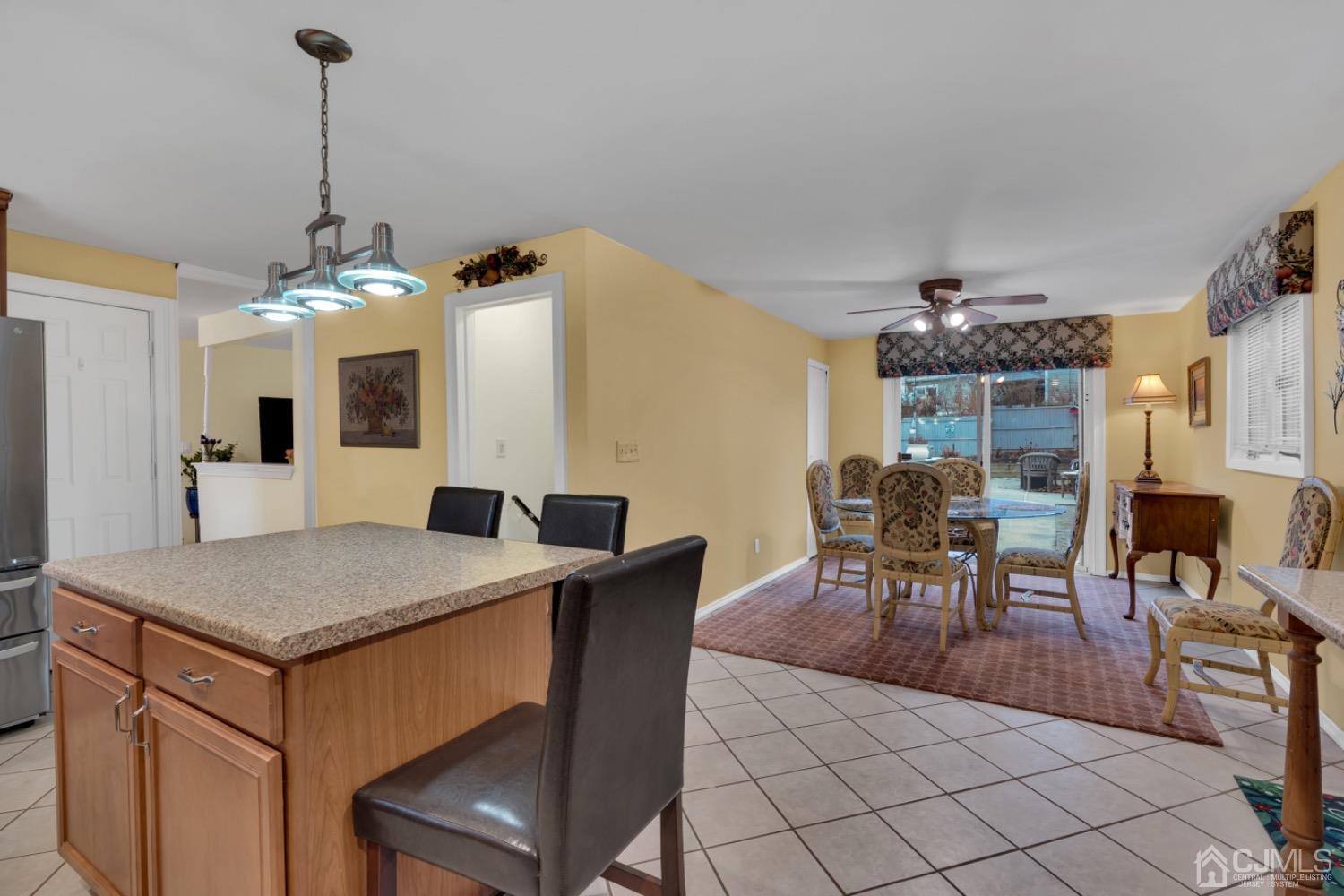 17 Temple Road, Unit 17 Old Bridge, NJ 08859 - Photo 19 of 40 a view of a dining room with furniture and chandelier
