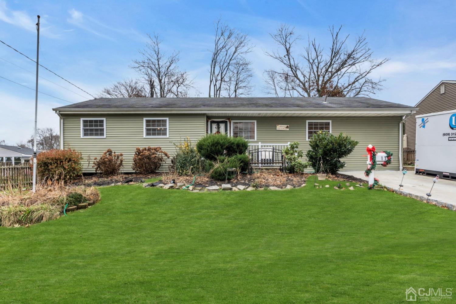 17 Temple Road, Unit 17 Old Bridge, NJ 08859 - Photo 2 of 40 a front view of house with yard and outdoor seating
