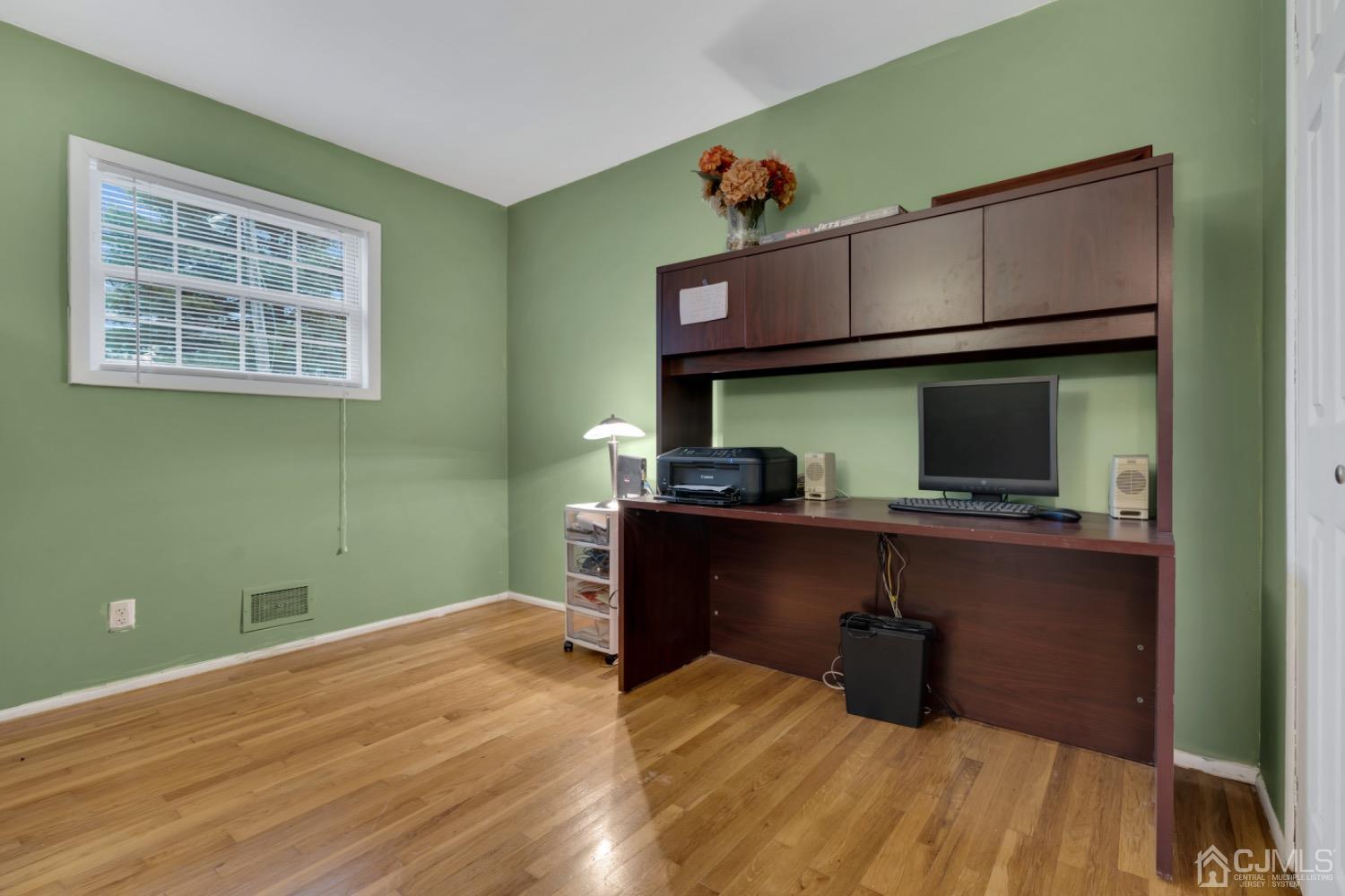 17 Temple Road, Unit 17 Old Bridge, NJ 08859 - Photo 22 of 40 a room with wooden floor and furniture