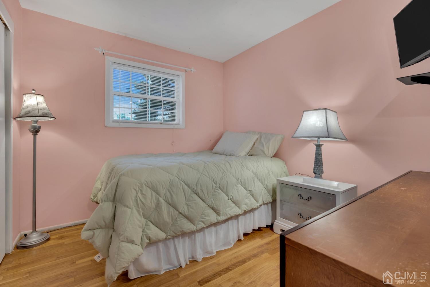 17 Temple Road, Unit 17 Old Bridge, NJ 08859 - Photo 23 of 40 a bedroom with a bed and a night stand