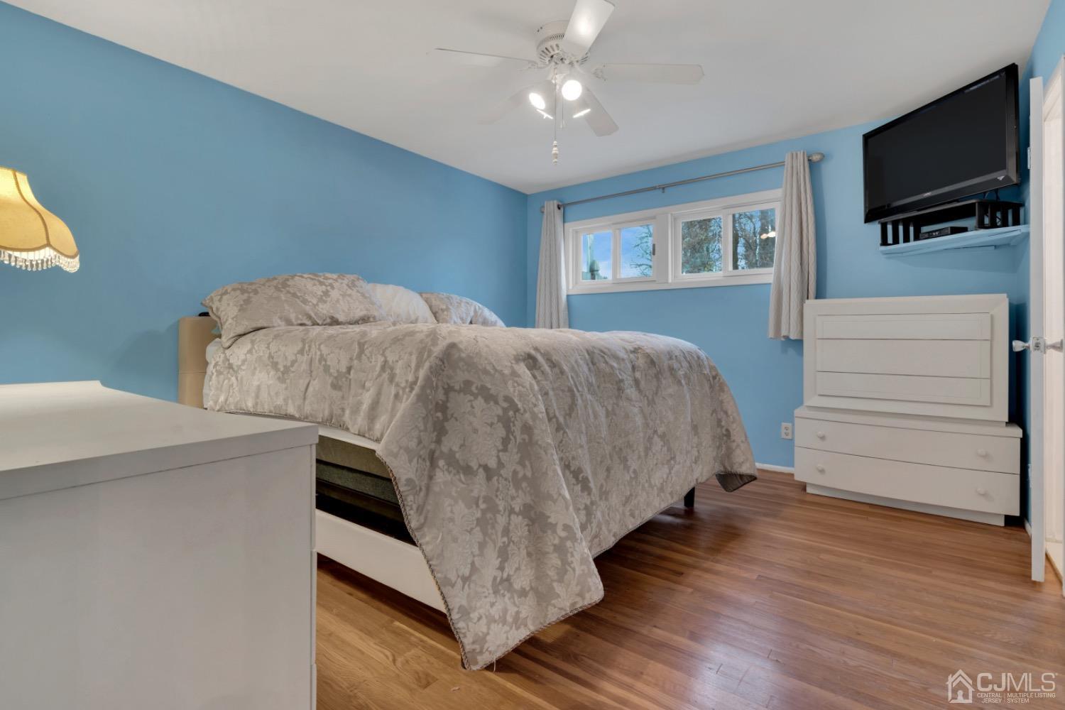 17 Temple Road, Unit 17 Old Bridge, NJ 08859 - Photo 24 of 40 a bedroom with a bed and flat screen tv
