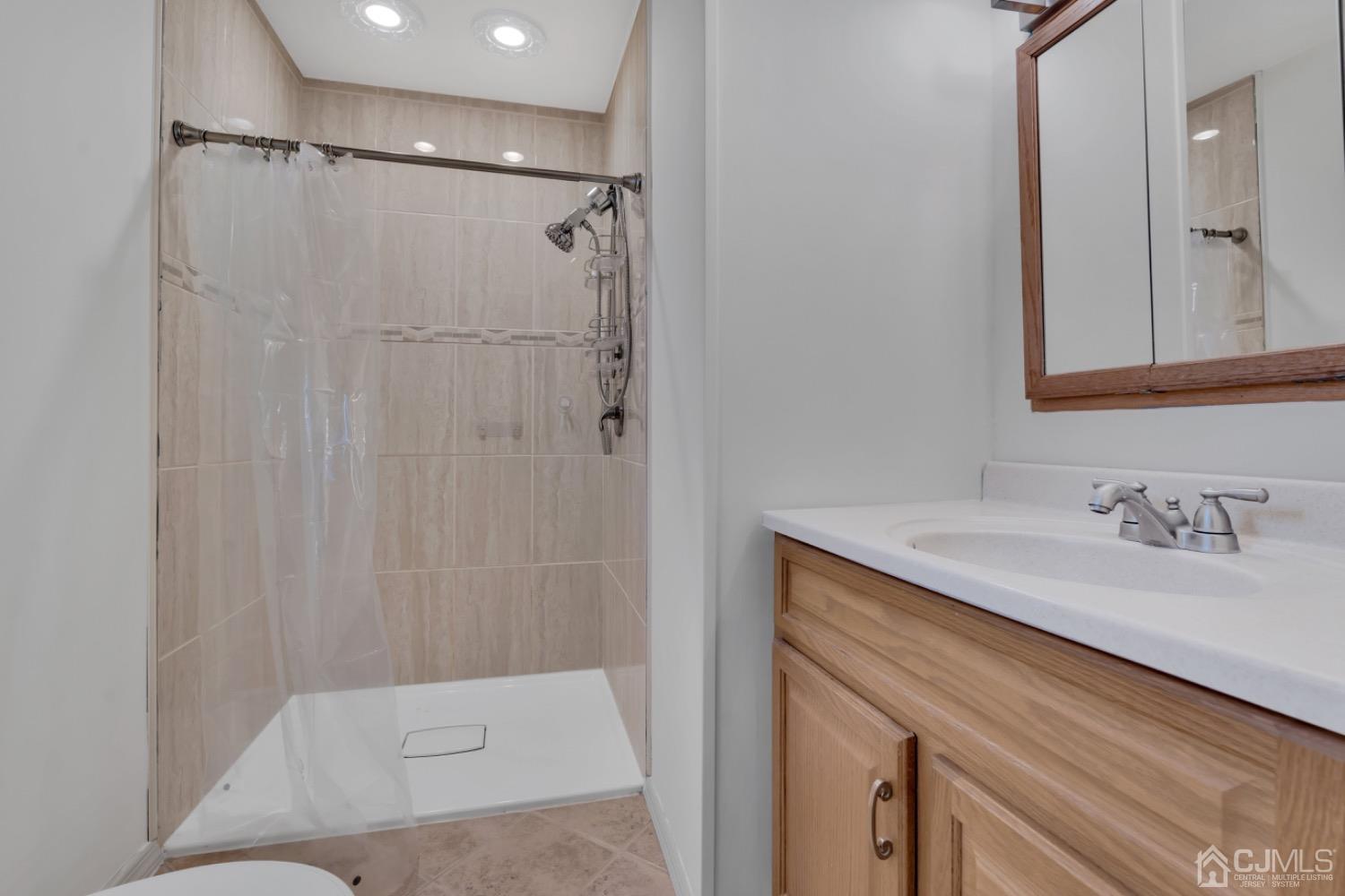 17 Temple Road, Unit 17 Old Bridge, NJ 08859 - Photo 28 of 40 a bathroom with a sink and a mirror