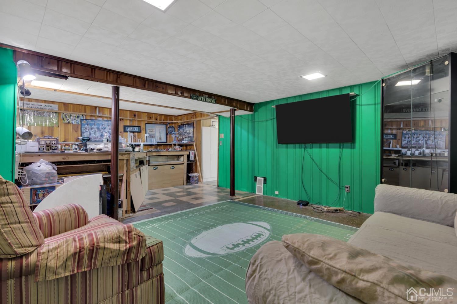 17 Temple Road, Unit 17 Old Bridge, NJ 08859 - Photo 35 of 40 a living room with a flat screen tv and a floor to ceiling window