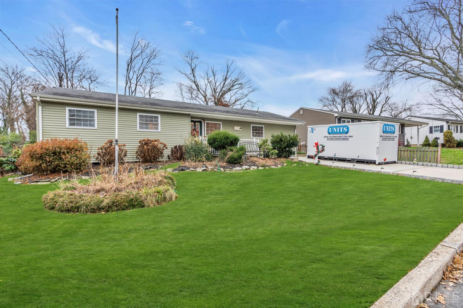17 Temple Road, Unit 17 Old Bridge, NJ 08859 - Photo 5 of 40 a front view of house with yard and outdoor seating
