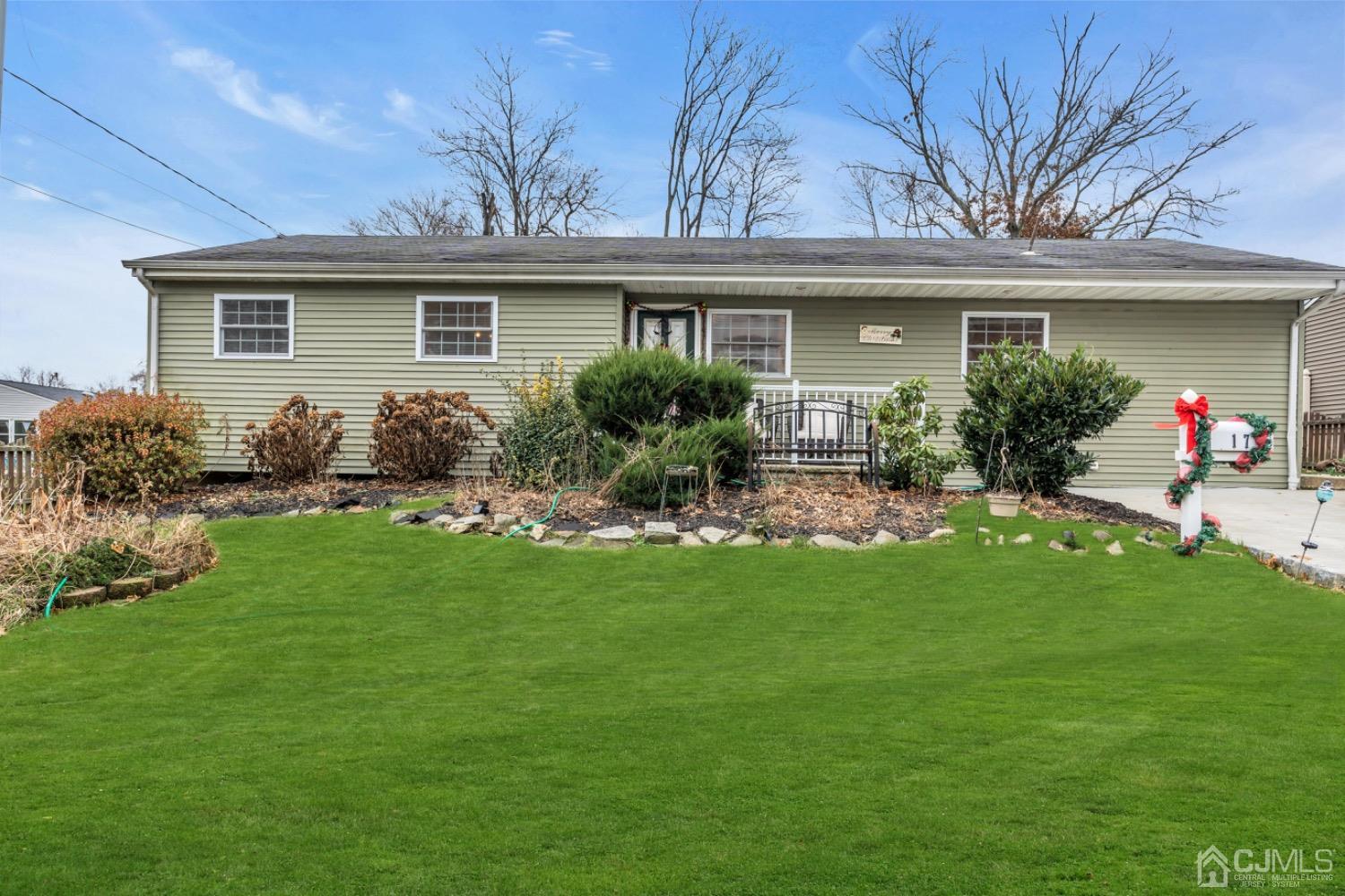 17 Temple Road, Unit 17 Old Bridge, NJ 08859 - Photo 7 of 40 a front view of house with yard and outdoor seating
