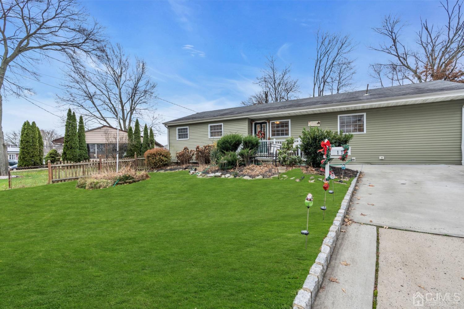 17 Temple Road, Unit 17 Old Bridge, NJ 08859 - Photo 8 of 40 a front view of a house with a garden and yard