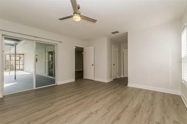 a bathroom with a toilet a sink a vanity and mirror