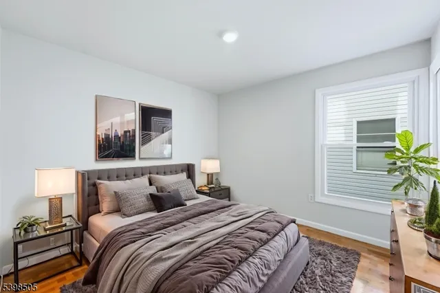 a bedroom with bed and a window