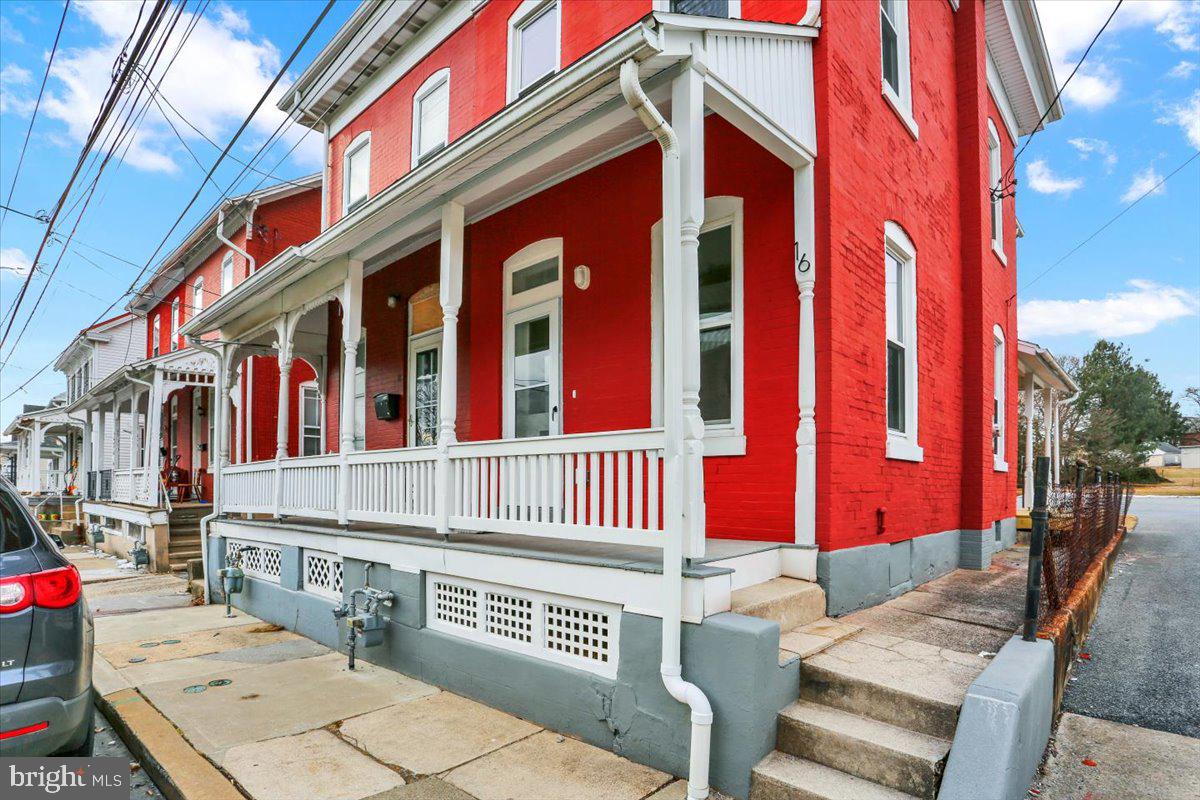 16 South Hull Street Reading, PA 19608 - Photo 2 of 30 a front view of multi story residential apartment building with a yard