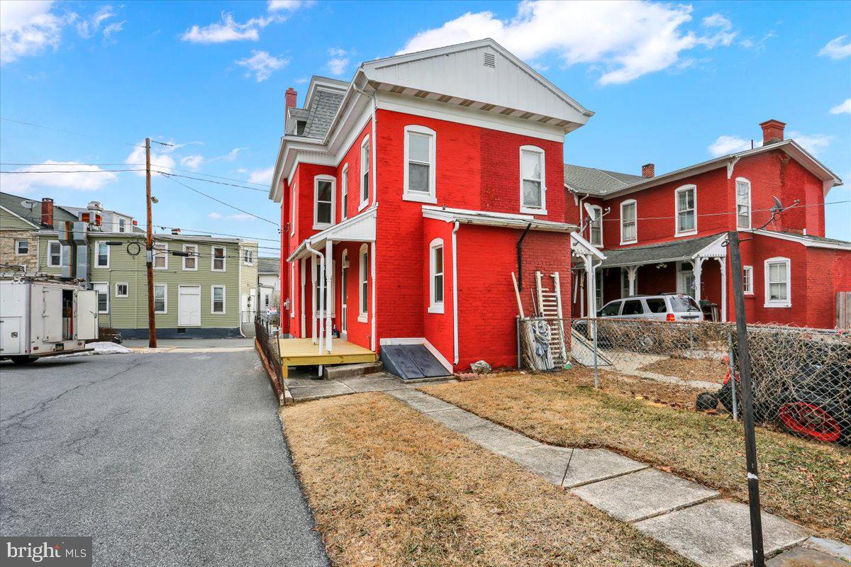 16 South Hull Street Reading, PA 19608 - Photo 29 of 30 a front view of a residential apartment building with a yard