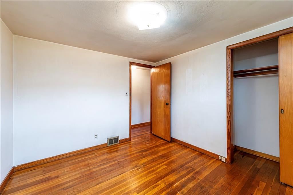 13740 Ridge Road Irwin, PA 15642 - Photo 17 of 43 a view of empty room with wooden floor