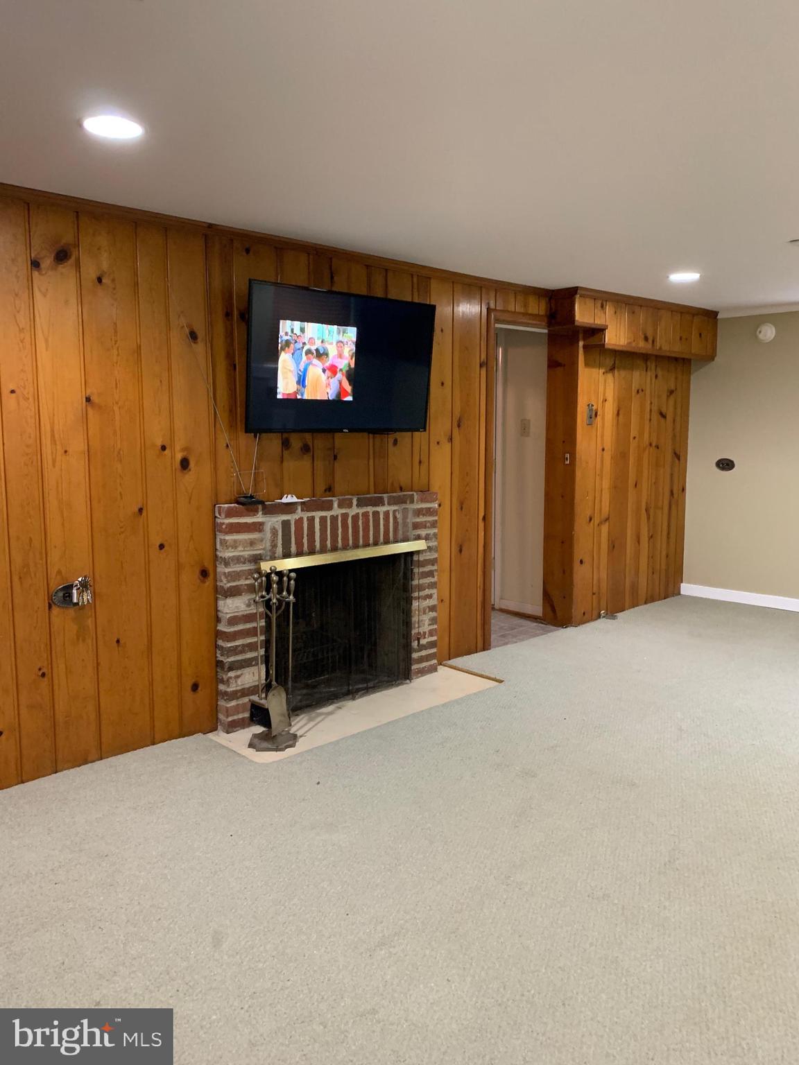 9503 Hale Place Silver Spring, MD 20910 - Photo 12 of 15 Lower Level Family Room with fireplace