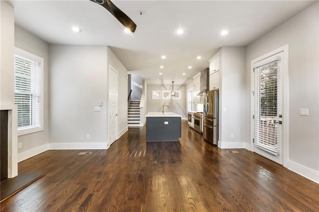 1819 Huntington Hills Lane Northwest Atlanta, GA 30309 - Photo 11 of 53 an empty room with wooden floor and windows
