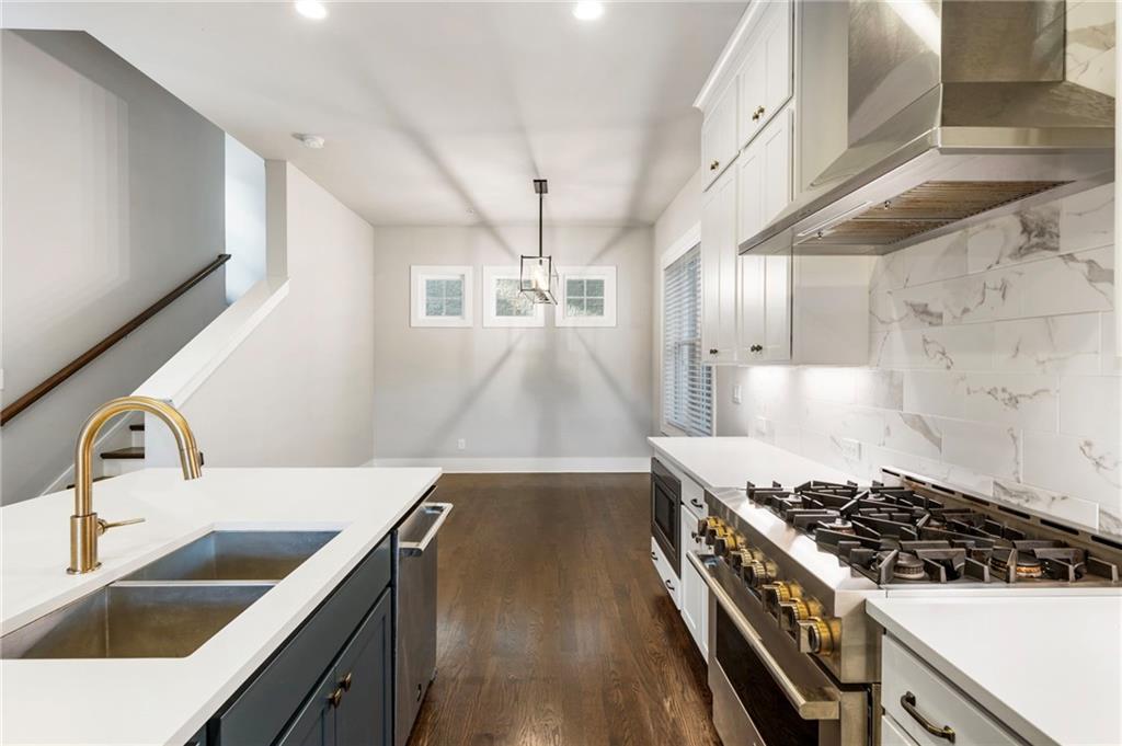 1819 Huntington Hills Lane Northwest Atlanta, GA 30309 - Photo 24 of 53 a kitchen with a stove and a sink