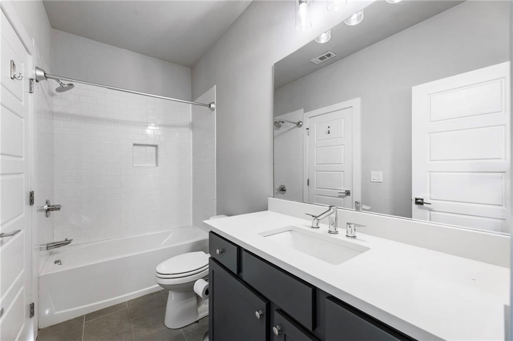1819 Huntington Hills Lane Northwest Atlanta, GA 30309 - Photo 45 of 53 a bathroom with a sink toilet tub and shower