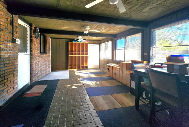 a lobby with furniture and floor to ceiling window