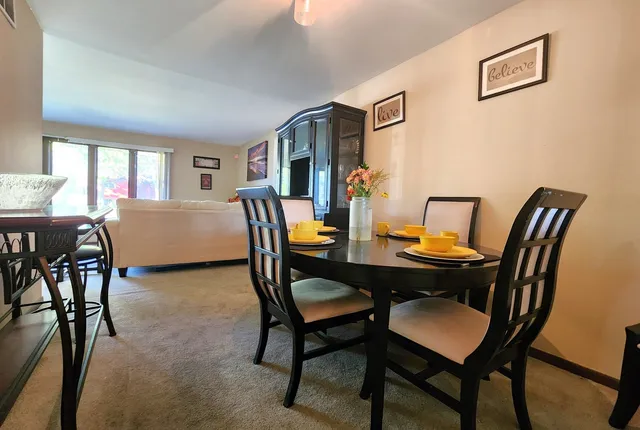 a view of a dining room with furniture