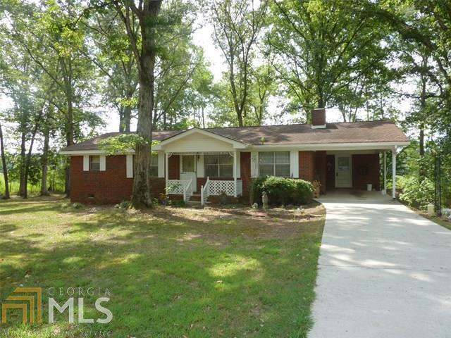 1881 Huffaker Road Northwest Rome, GA 30165 - Photo 1 of 1 front view of a house with a yard