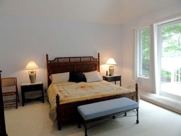 21 Greensward Road Mashpee, MA 02649 - Photo 11 of 22 a bedroom with a bed chair and a window