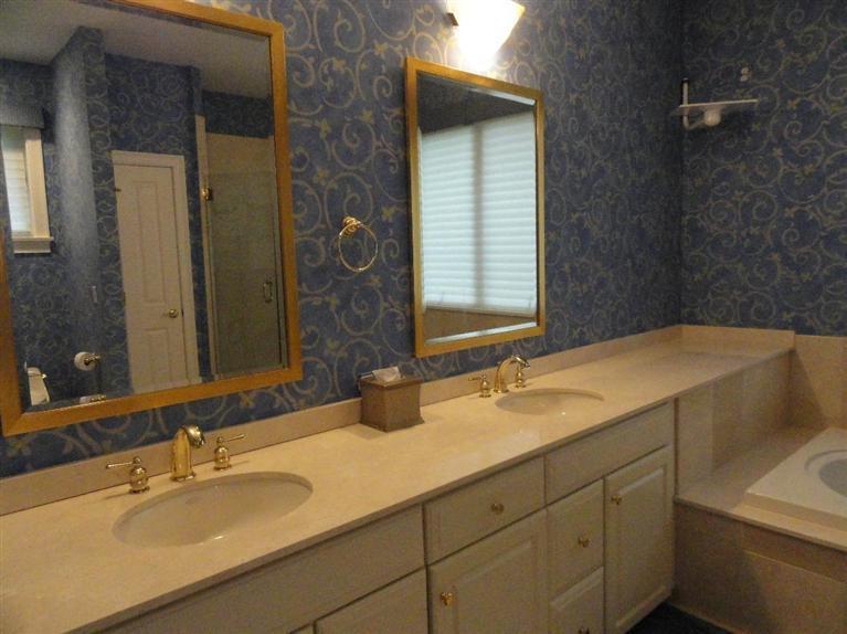 21 Greensward Road Mashpee, MA 02649 - Photo 12 of 22 a bathroom with a sink and a mirror