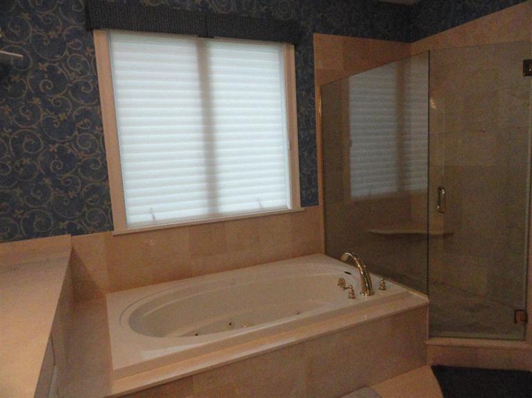 21 Greensward Road Mashpee, MA 02649 - Photo 13 of 22 a bathroom with a bathtub