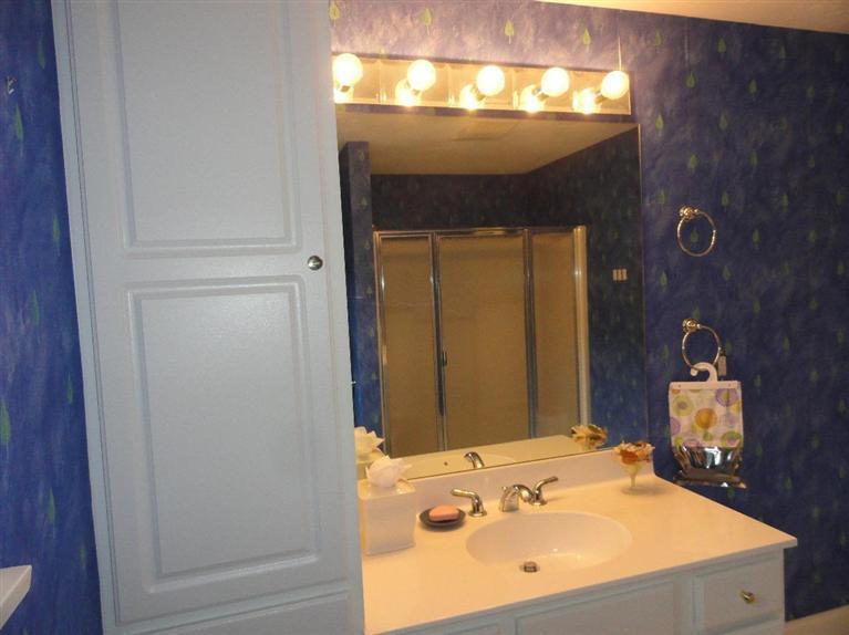 21 Greensward Road Mashpee, MA 02649 - Photo 17 of 22 a bathroom with a sink and a mirror
