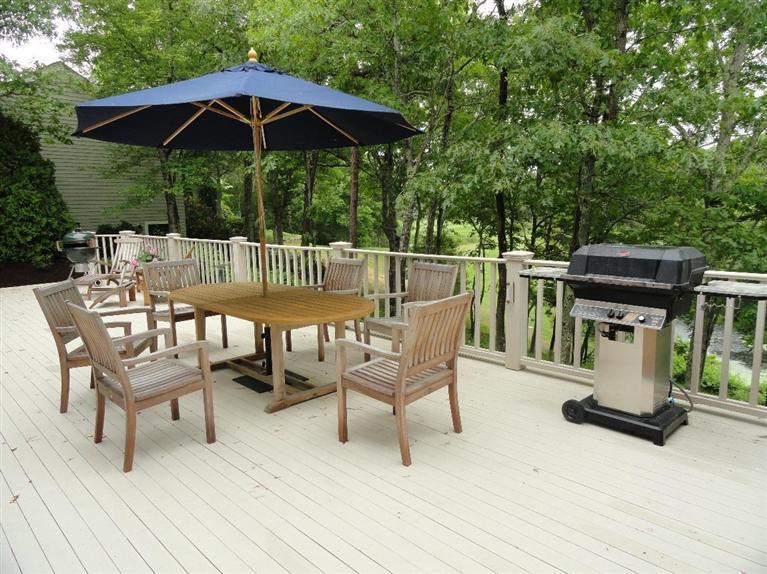 21 Greensward Road Mashpee, MA 02649 - Photo 20 of 22 a view of balcony with outdoor seating and trees