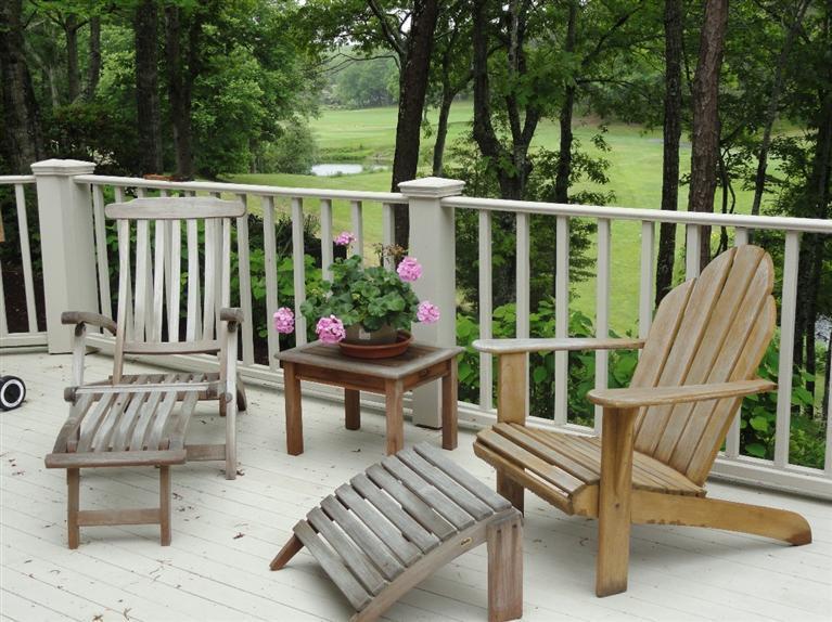 21 Greensward Road Mashpee, MA 02649 - Photo 21 of 22 a view of a chairs and tables in the balcony
